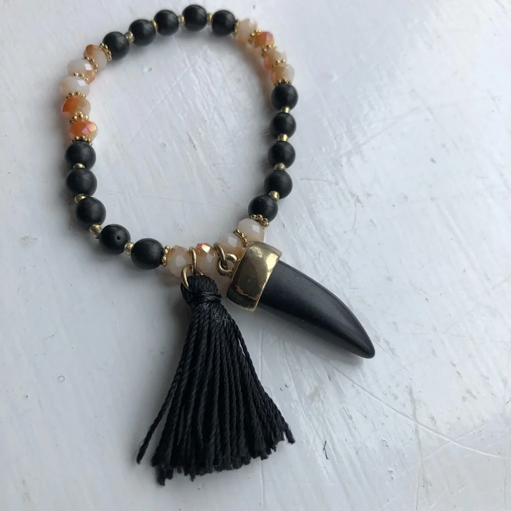 earthy neutral beaded horn tassel stretch bracelet